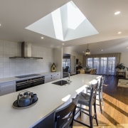 The kitchen in this Tauranga GJ Gardner showhome countertop, interior design, kitchen, real estate, room, gray