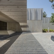 The choice of sandstone cladding right across the architecture, building, cement, concrete, facade, floor, flooring, house, line, property, residential area, gray, black