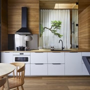 The interior designers opened up the kitchen, living, 