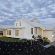 A classic Hamptons style weatherboard exterior gives way 