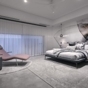 The bedroom's contemporary feature wall finish tones with 