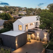 The expansive fusion-style home at dusk. - Villa 