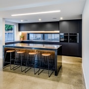 For this project, the homeowners wanted a matt apartment, architecture, building, cabinetry, ceiling, countertop, design, dining room, floor, flooring, furniture, home, house, interior design, kitchen, living room, property, real estate, room, table, gray