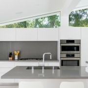 The kitchen is pared back to minimalist effect, 