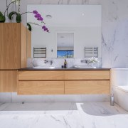 Marble look surfaces combine with the warmth of 