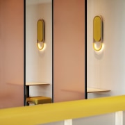 The bespoke lighting throughout the space further reveal 