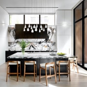 The contemporary kitchen with contemporary pendants to match. 