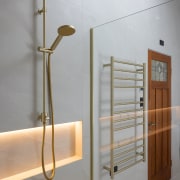 An internally lit shower niche and heated towel 