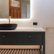 A custom vanity combines open shelving with ample 