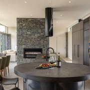 The wood-finished cabinetry works well with the surrounding 