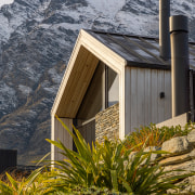 A jagged peak in a rugged mountain landscape. 
