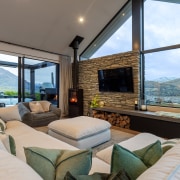 Lake and mountain views from the high-ceilinged living 
