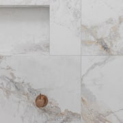 The stone's rich veining connects with the accessories' 