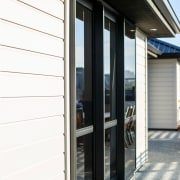 Envira Weatherboards Installed Using Precut Scribers For A door, facade, home, house, real estate, siding, window, white, gray