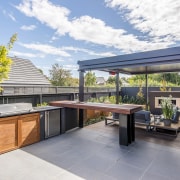 Barbecue and bar fridge with timber doors on 