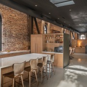 Existing windows and skylights flood the lounge and 