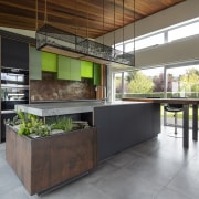 The hanging storage/display mesh-sided shelving above the kitchen 