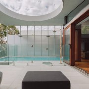 The covered outdoor living space and pool area 