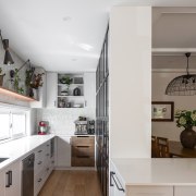Kitchen with open shelving and feature wall tiles 
