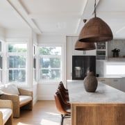 Kitchen island with eye-catching pendants above. 