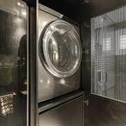 Looking through the laundry cabinet's mesh screen to 