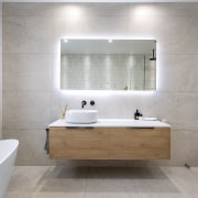 Both the wall-hung nature of the vanity and 