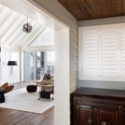 Custom shutters were designed by the architect for 