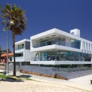 Cantilevered terraces and a matching roof reinforce the apartment, architecture, building, commercial building, corporate headquarters, estate, facade, home, house, mixed use, property, real estate, residential area, resort, villa, blue