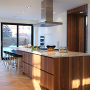 The contemporary kitchen includes classic elements, such as 