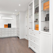 The dressing room with panelled cabinetry and glass 