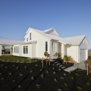 White weatherboard cladding is central to the Landmark 