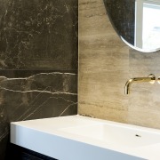 Brass accents are a feature of this bathroom. 