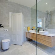 Opting for a glass shower stall extended the architecture, bathroom, building, ceramic, floor, flooring, furniture, home, house, interior design, material property, plumbing fixture, property, real estate, room, tap, tile, wall, gray