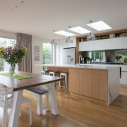The floor plan consists of an open plan countertop, cuisine classique, floor, house, interior design, kitchen, real estate, gray
