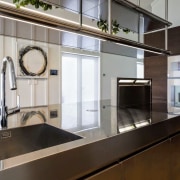 A pop-up Gaggenau extractor does away with the countertop, interior design, kitchen, gray, black