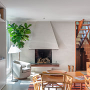 The original fireplace and stair have been restored. 