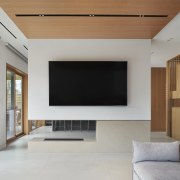 A second limestone-surround fireplace divides lounge and kitchen. 