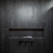 Even the shower has a moody, glamorous air. 