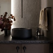 The rock edge stone benchtop is matched with 