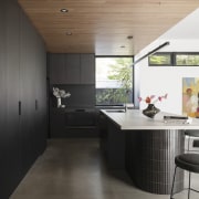 Kitchen and a wall of kitchen storage cabinetry. 