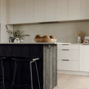 The Caesarstone benchtop extends out along the front 