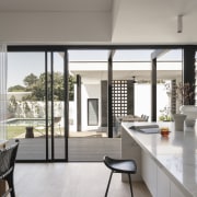 Kitchen with backyard and garage behind. - Secret 