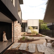 Courtyard with rustic paving elements. - Enduring aesthetic 