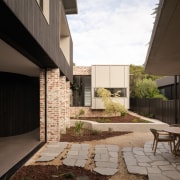 Courtyard with rustic paving elements. - Enduring aesthetic 
