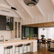 Kitchen with soaring ceiling, courtesy of gabled roof 