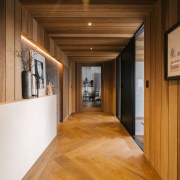 Rich herring-bone patterned flooring features in the front 