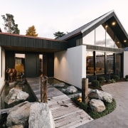 Floating stepping stone pavers across a pond create 