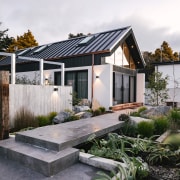 Front path to pool house with pool behind 