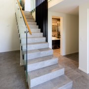 The sculptural concrete stair is an interior feature. 