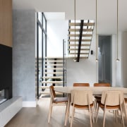 New central dining area beside contemporary fireplace. 